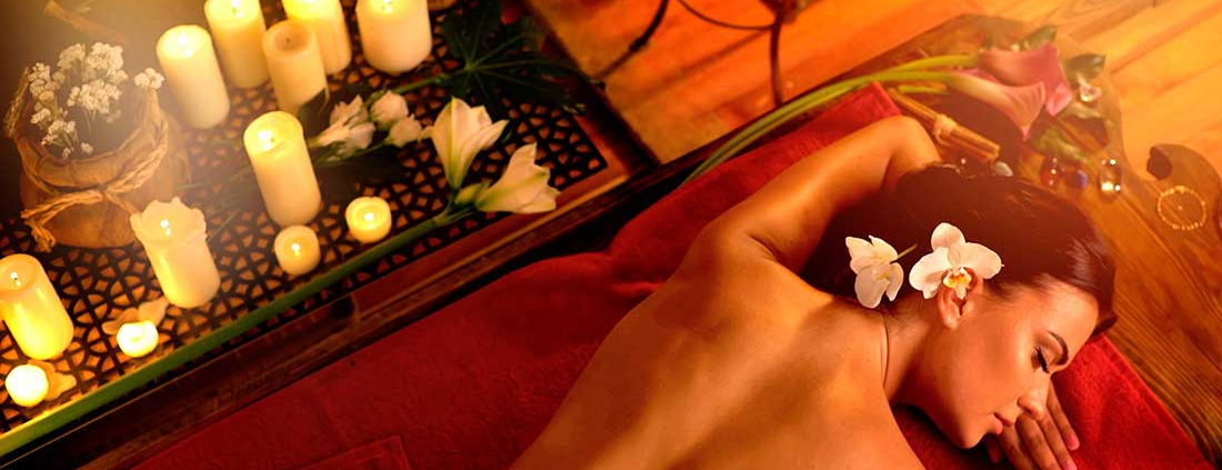 Massage,Of,Woman,In,Spa,Salon.,Girl,On,Candles,Background